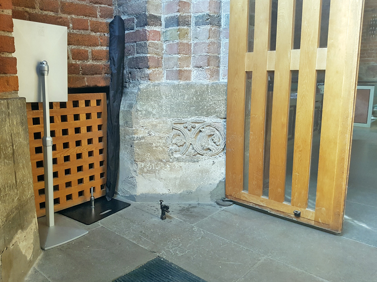 A stone from the first Romanesque 12th century church in the entrance hall of the Clositer church in Lund
