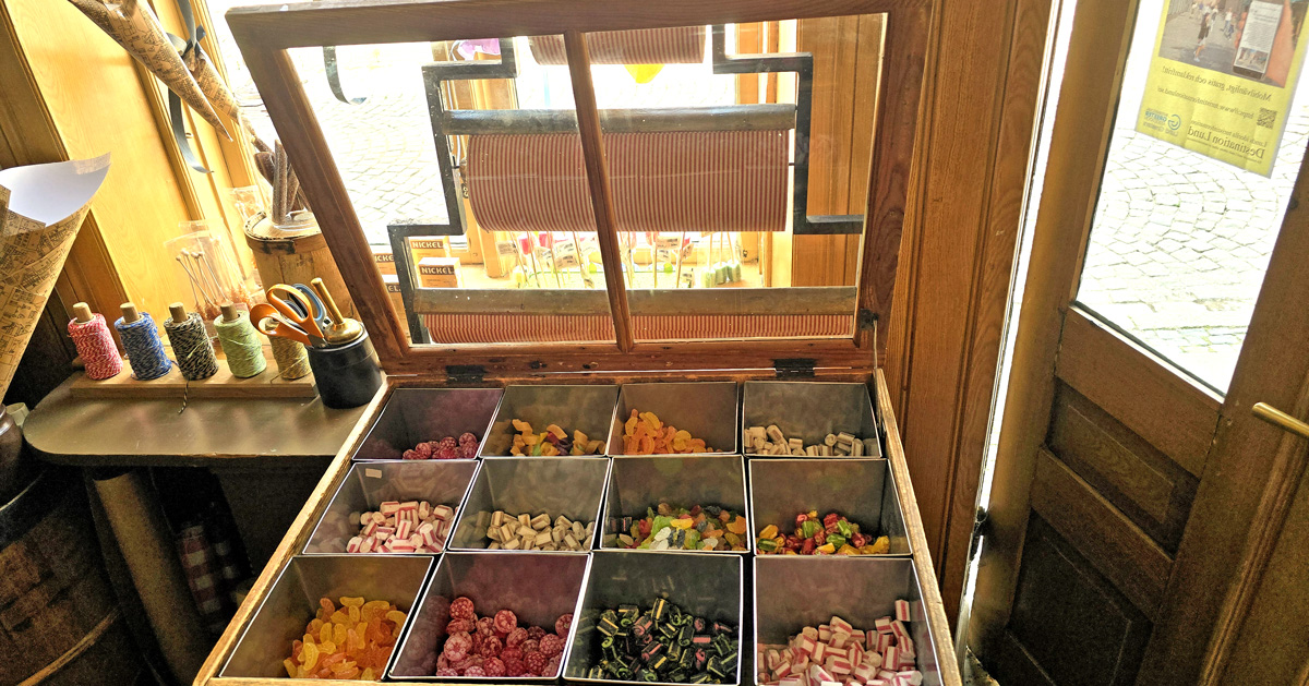 Old-fashioned sweets in the wooden box on the counter in Hökeriet in Lund