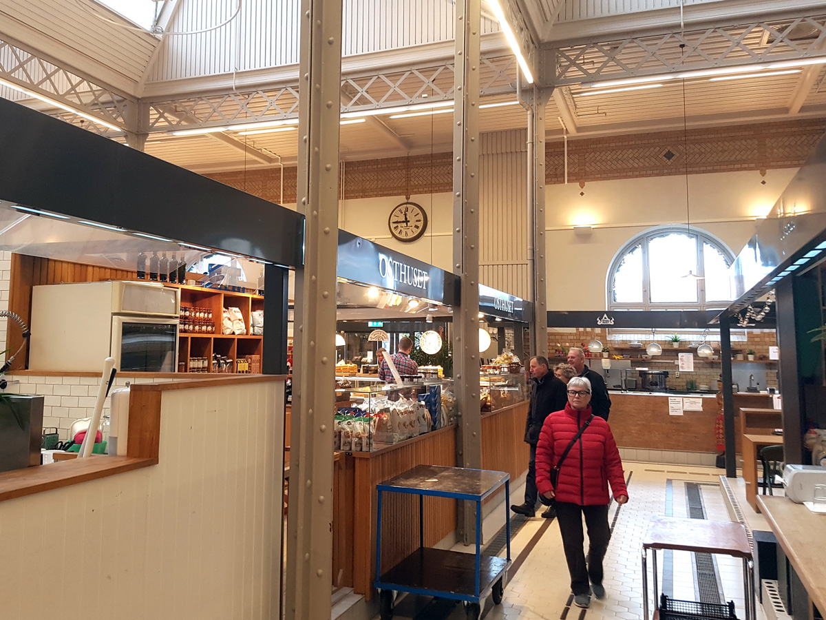 The iron structure in the Lund Market Hall and the old clock on the wall