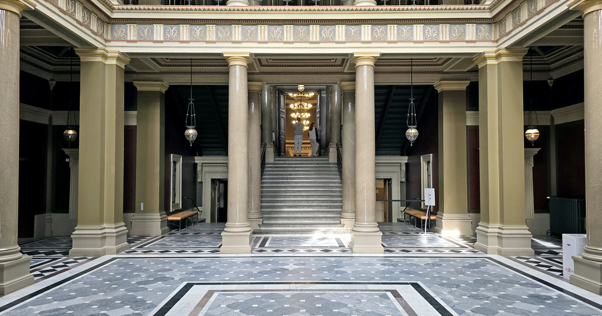 The atrium inside the Lund University Main Building entrance.